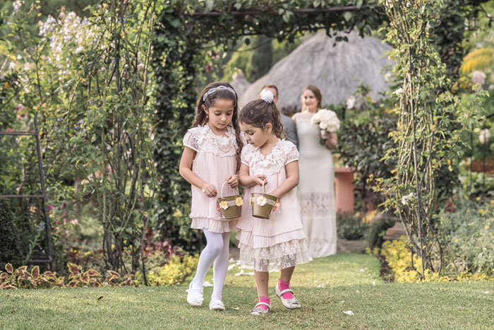 flower girls walking down the aisle