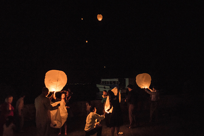 wedding guests releasing wish lanterns