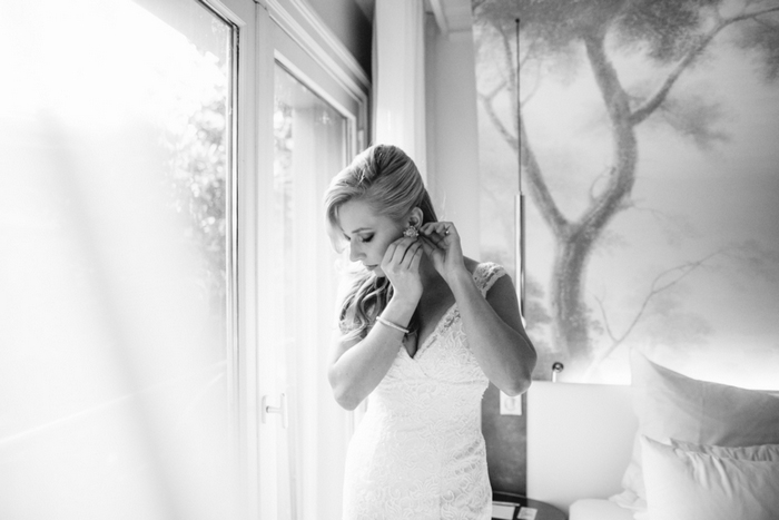 bride putting on earring