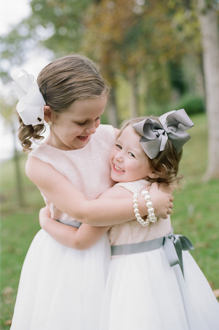 flower girls hugging