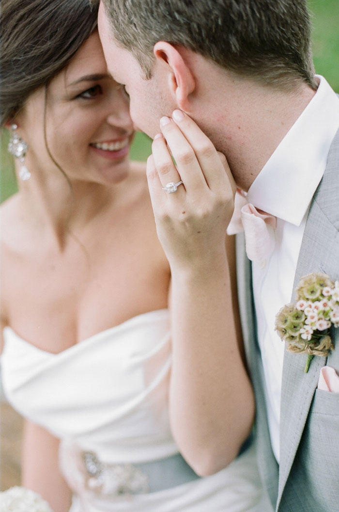 bride touching groom's face