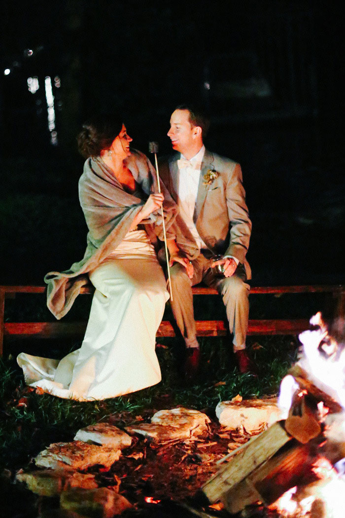 bride and groom toasting marshmallows