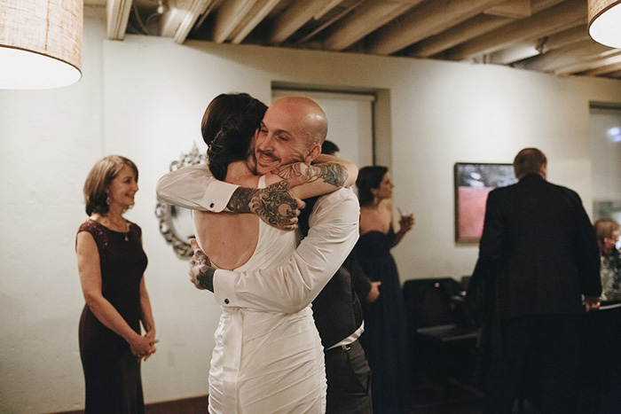 bride and groom hugging on the dance floor