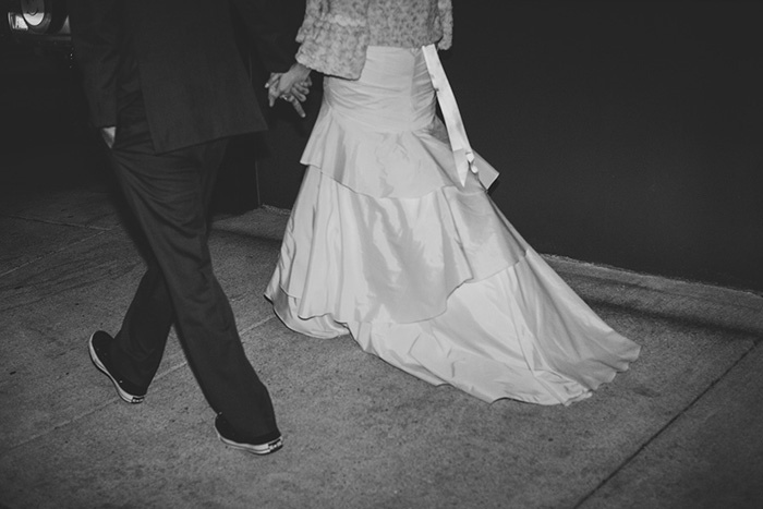 bride and groom walking down the street