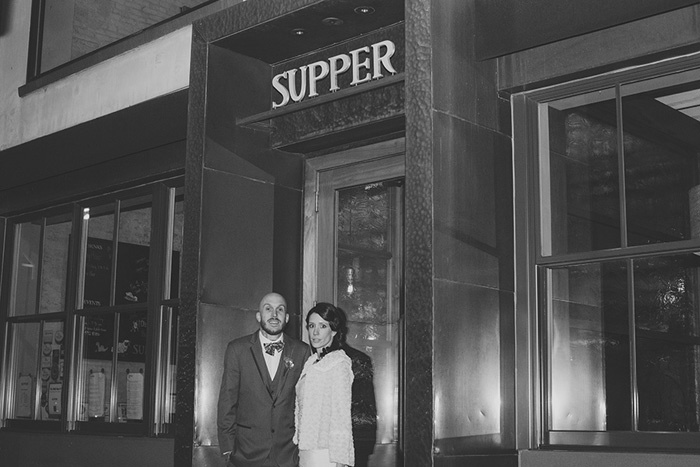 bride and groom outside of restaurant