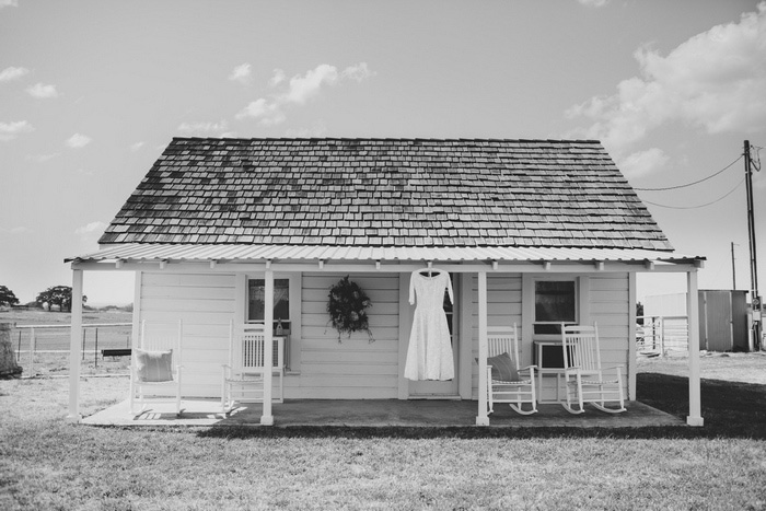 wedding dress hanging on porch