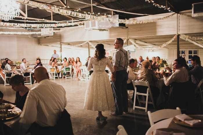 bride and groom at barn reception