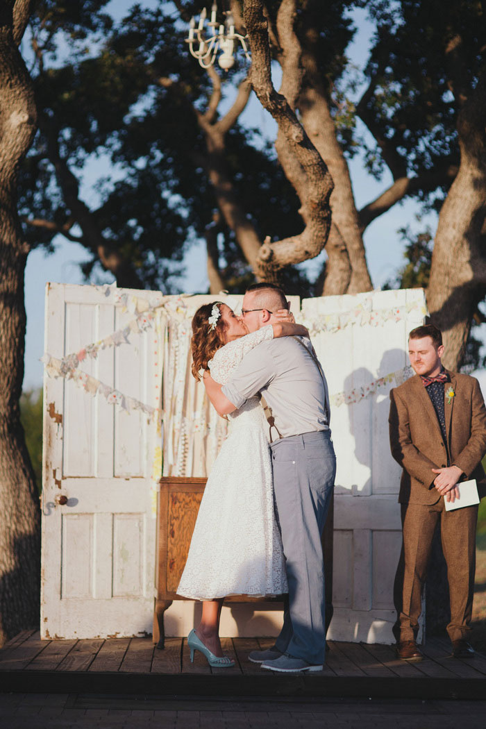 bride and groom first kiss