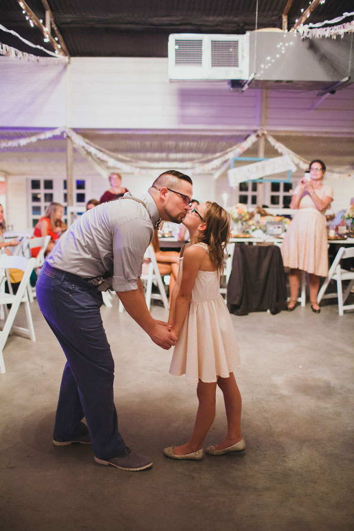 groom kissing his daughter