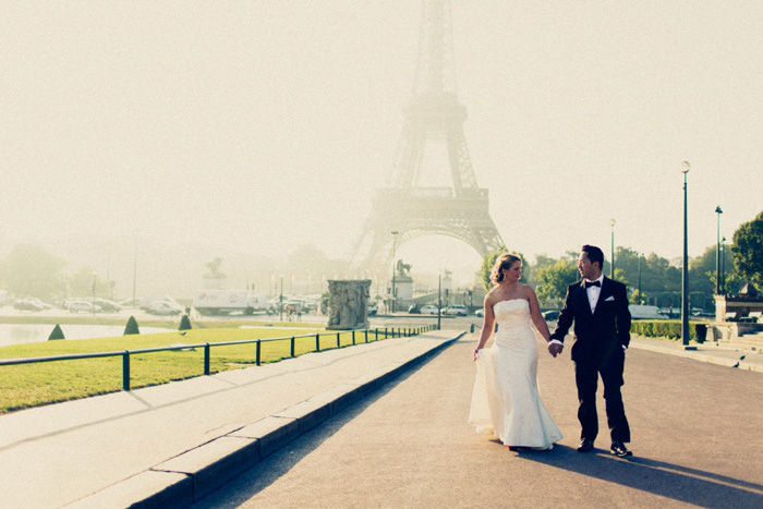 bride and groom in front of Eiffel Tower