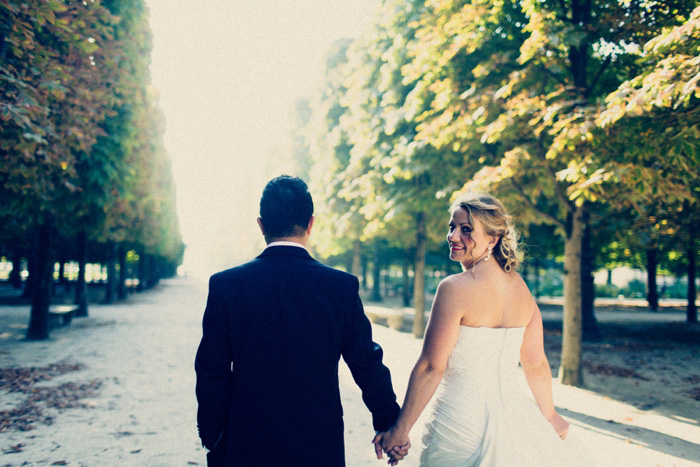 bride and groom walking in Paris