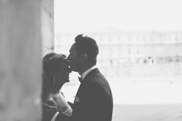 groom kissing bride's forehead