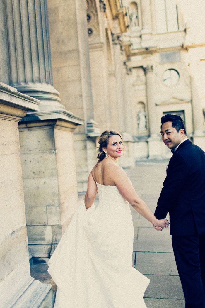 bride and groom walking in Paris