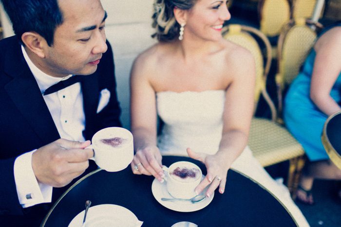 bride and groom having coffee in Paris