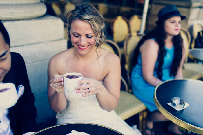 bride and groom having coffee in Paris