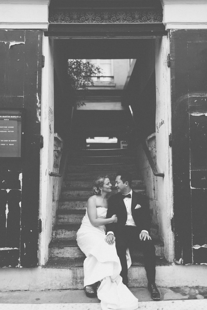 bride and groom in Paris stairwell