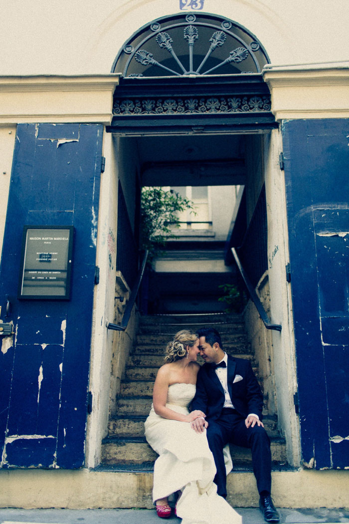 Bride and groom in Paris stairwell