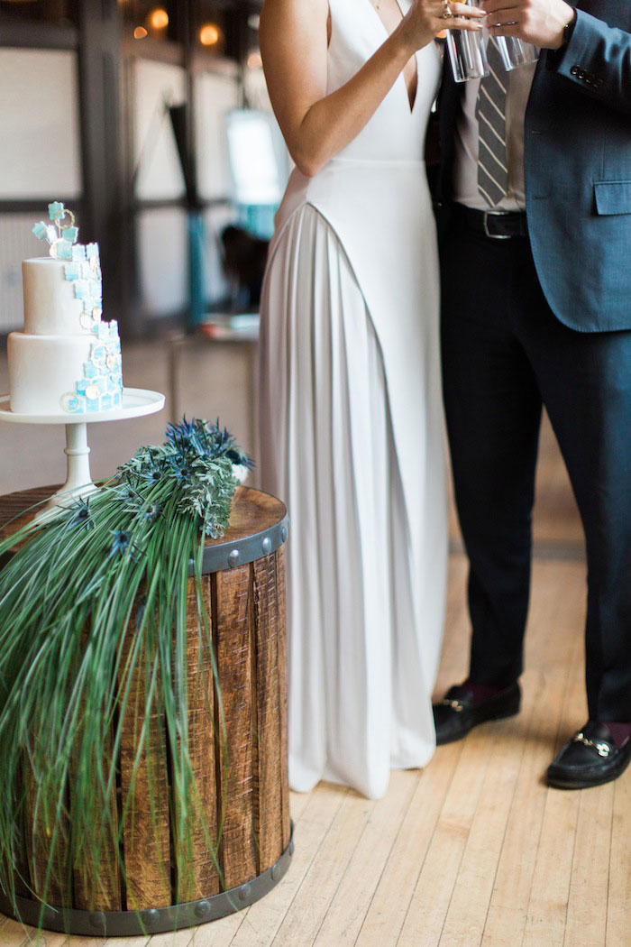 bride and groom drinking champagne