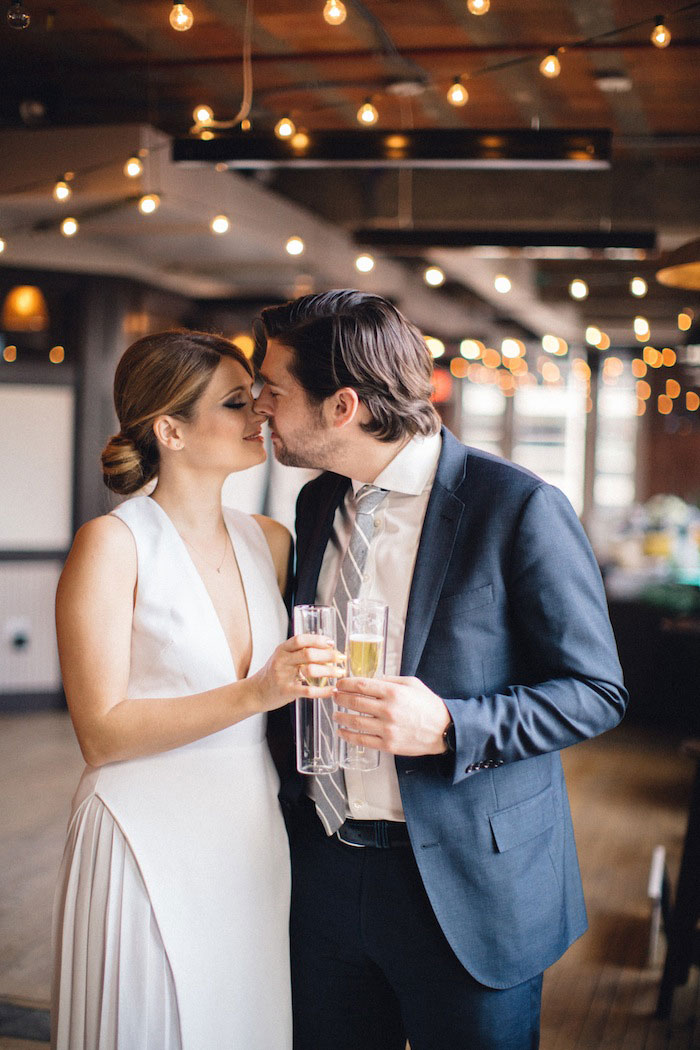 bride and groom with champagne