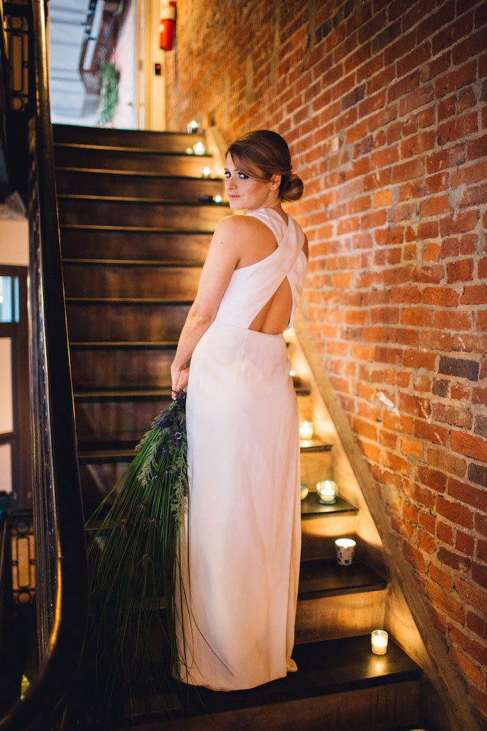 bride on candlelit stairs