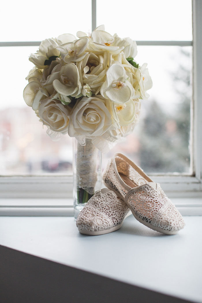 white rose wedding bouquet and lace Tom's shoes