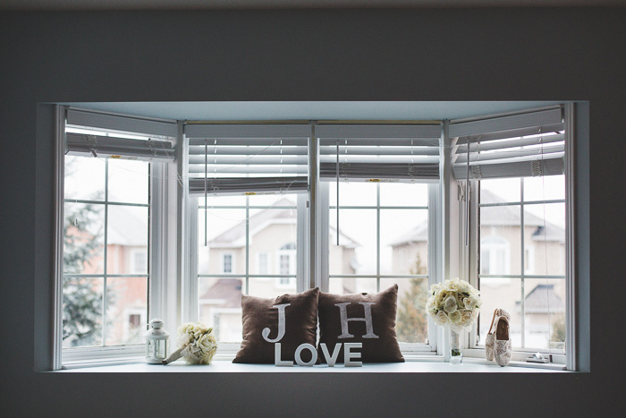 monogrammed pillows and love sign on window seat