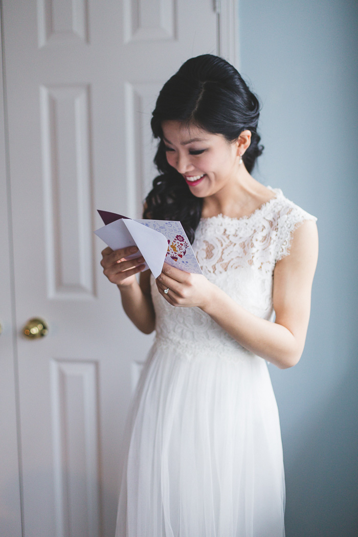 bride reading card from groom