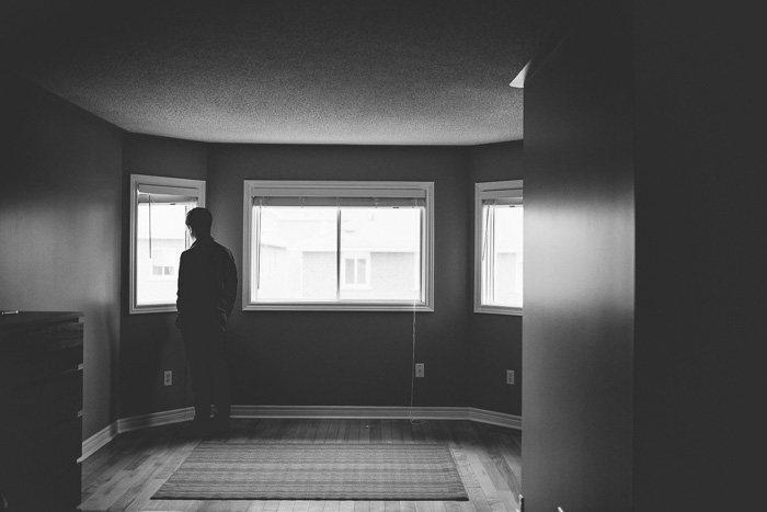 groom looking out window