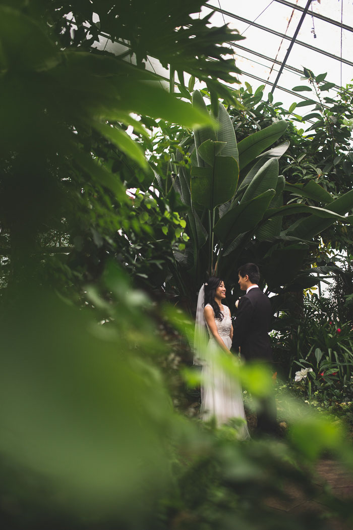 bride and groom portrait in conservatory