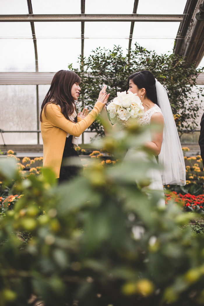 bride high fiving guest