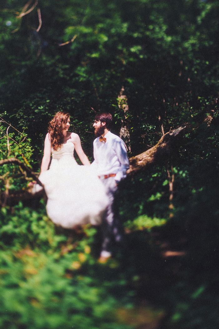 bride and groom in the woods