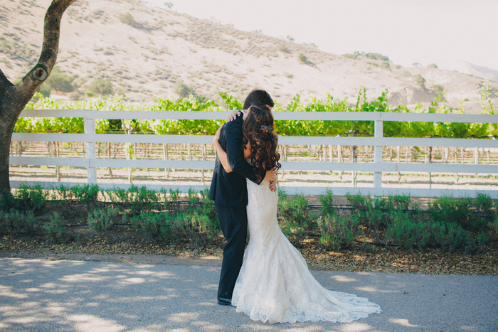 bride and groom hugging