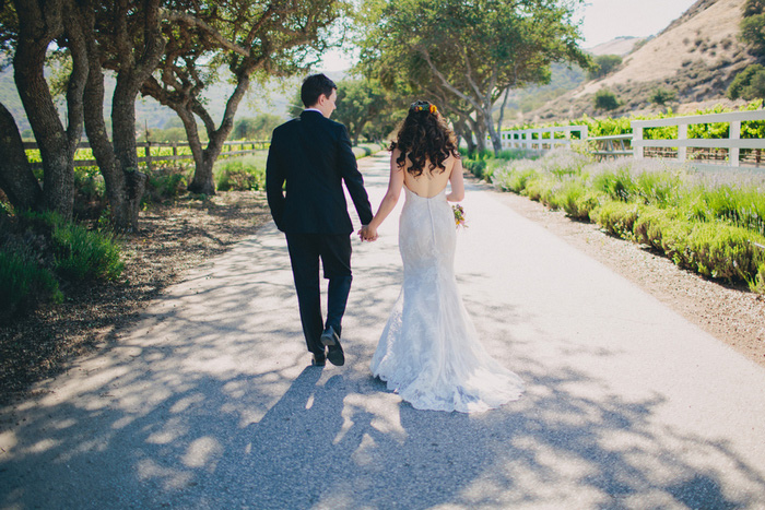 bride and groom walking away