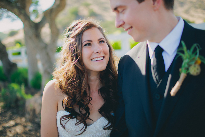 bride smiling up at her groom