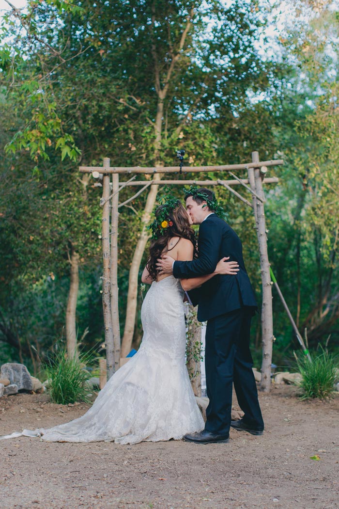 bride and groom first kiss