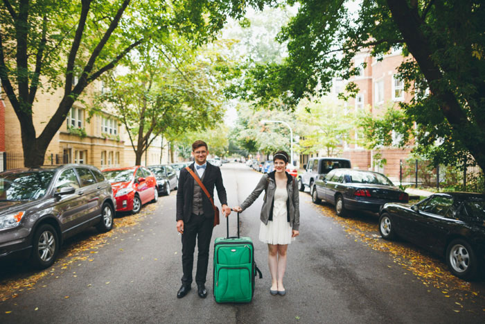 bride and groom with suitcase