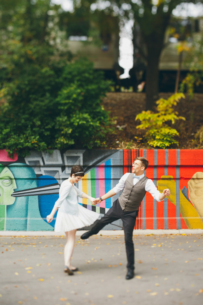 bride and groom dancing in the street