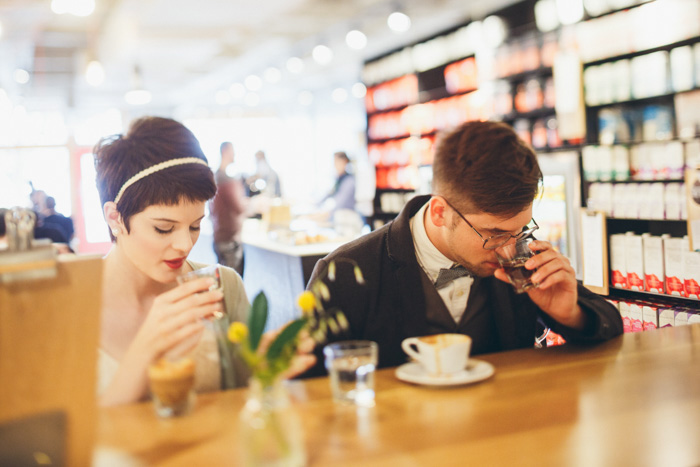 bride and groom tasting coffee