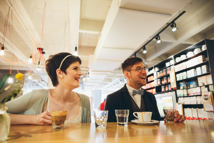 bride and groom tasting coffee