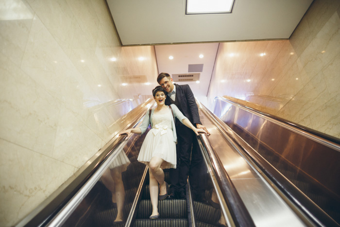 bride and groom on escalator