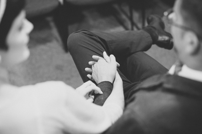 bride and groom holding hands