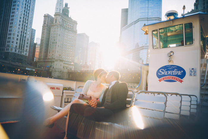 bride and groom kissing on ferry