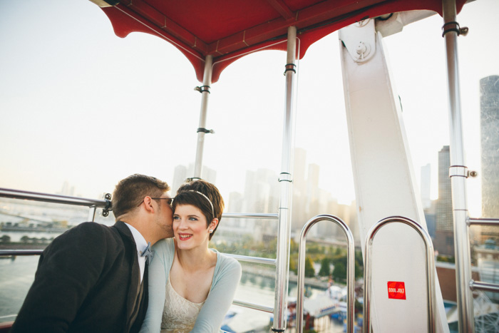 bride and groom on ferris wheel