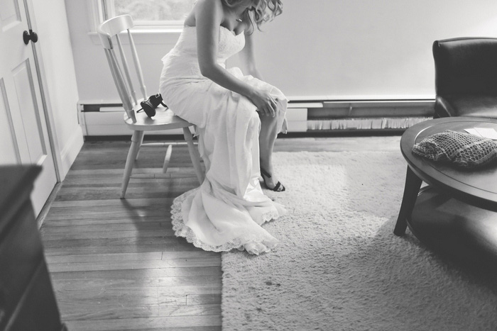 bride putting on shoes