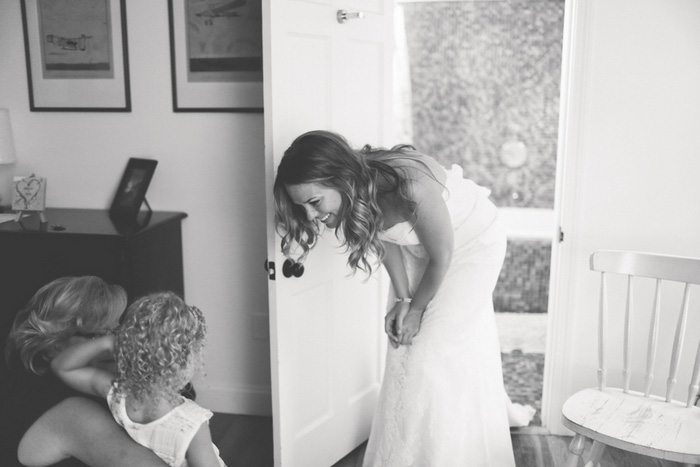 bride talking to flower girl 