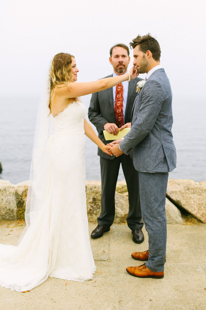 bride wiping away groom's tears