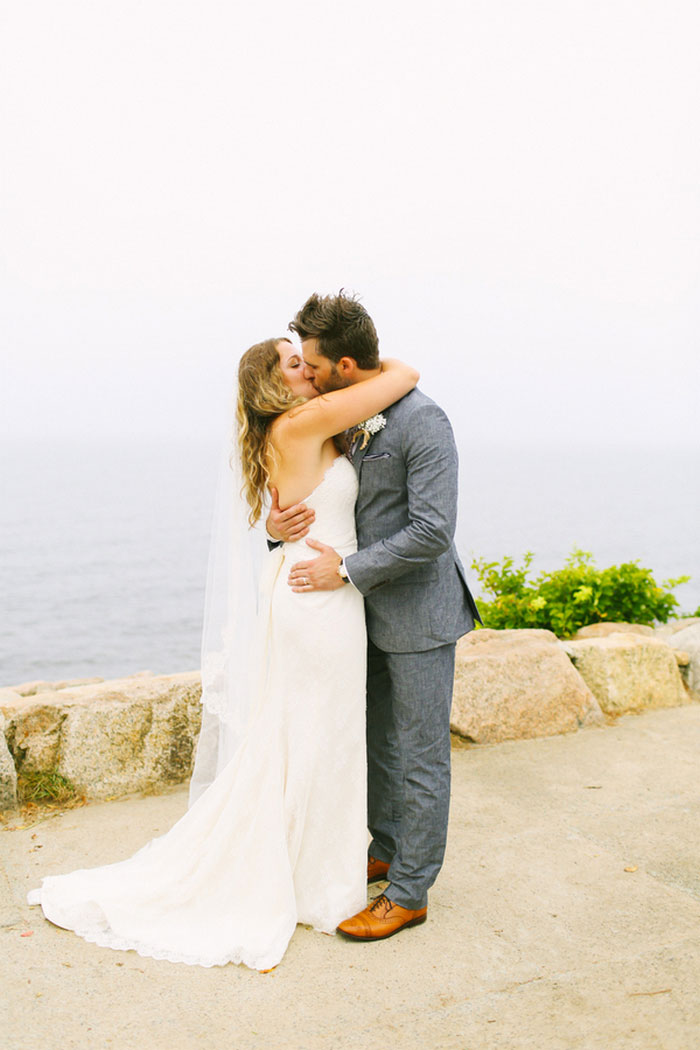 bride and groom first kiss