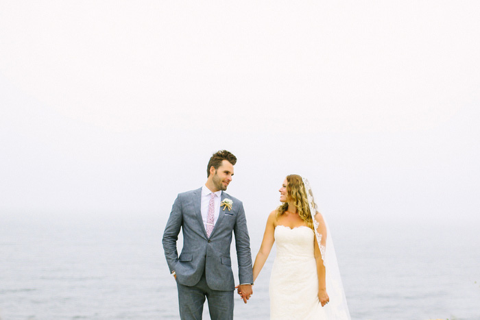 bride and and groom portrait by the sea