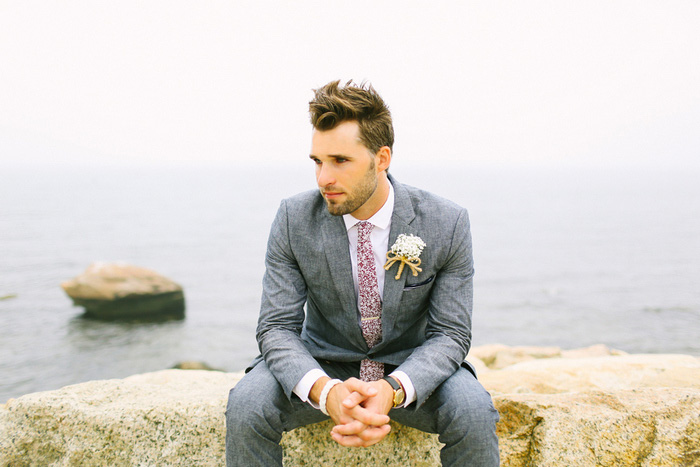 groom portrait by the sea