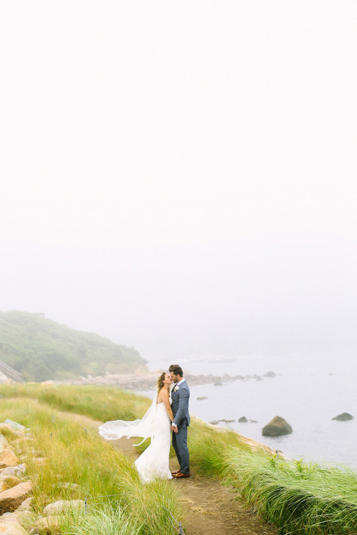 bride and and groom portrait by the sea